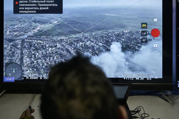 A Ukrainian soldier watches a drone feed from an underground command center in Bakhmut, Donetsk region, Ukraine, Sunday, Dec. 25, 2022.