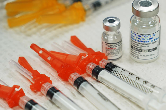 Bivalent COVID-19 vaccines are readied for use at a clinic in Richmond, Va., Nov. 2022. Just 15% of eligible Americans have gotten the most recent booster shot, according to the CDC.