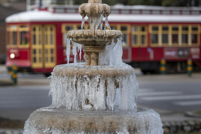 The fountain is frozen as temperatures hovered in the mid 20s at Jacob Schoen & Son Funeral Home in New Orleans on Dec. 24, 2022.