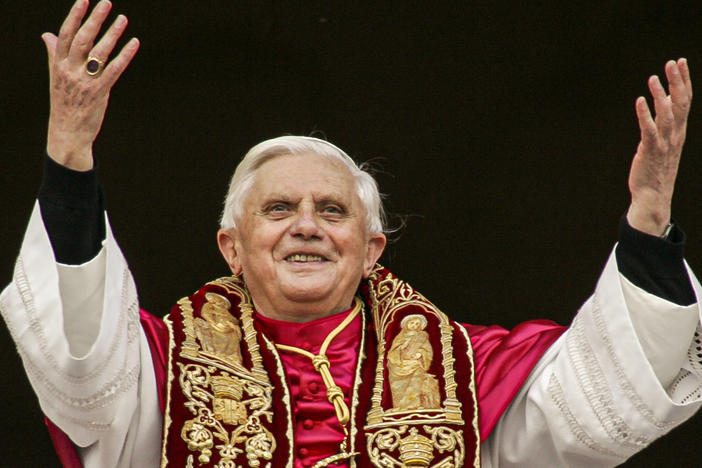 Pope Benedict XVI greets the crowd from the central balcony of St. Peter's Basilica at the Vatican in 2005, soon after his election.