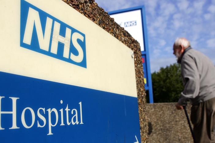 A man walks past a National Health Service sign in 2007 in London. The NHS offers services at the Askern Medical Practice in Doncaster, whose patients mistakenly received text messages informing them of a terminal cancer diagnosis.