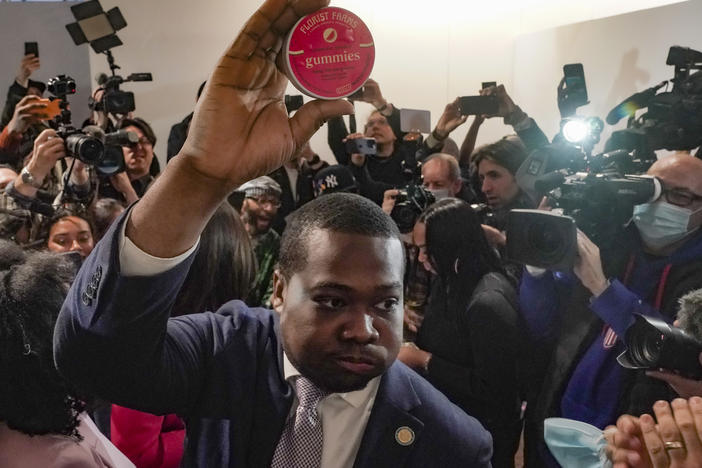 Chris Alexander, executive director of the New York State Office of Cannabis Management, shows off the first purchase of cannabis gummies bought at Housing Works — New York's first legal cannabis dispensary, during a press conference to kick-off its opening on Thursday.