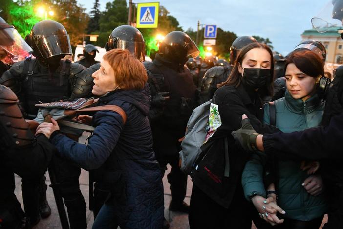 Police officers detain demonstrators in St. Petersburg, Russia, on Sept. 21, following calls to protest against the partial mobilization announced by President Vladimir Putin. Putin called on Russian military reservists, saying his promise to use all military means in Ukraine was "no bluff," and hinting that Moscow was prepared to use nuclear weapons.