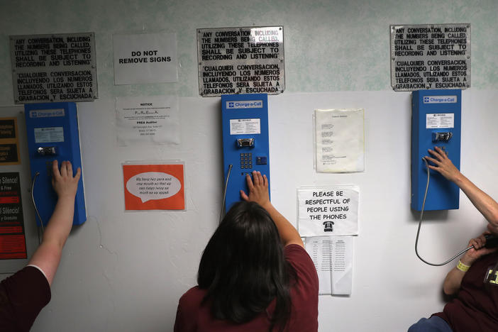 Prison inmates make one of their daily allotment of six phone calls at the York Community Reintegration Center.