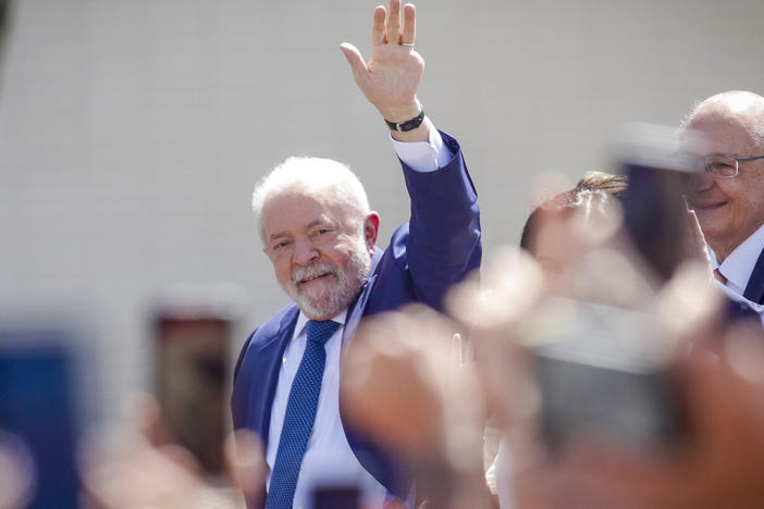 President-elect Luiz Inácio Lula da Silva waves from an open car after departing from the Metropolitan Cathedral to Congress for his swearing-in ceremony, in Brasília, Brazil, on Sunday.