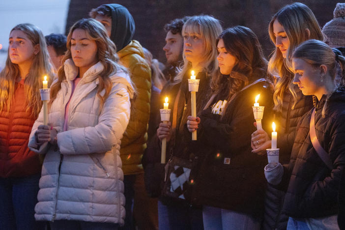 Boise State University students, along with people who knew the four University of Idaho students who were found killed in Moscow, Idaho, in November, pay their respects at a vigil on November 17.