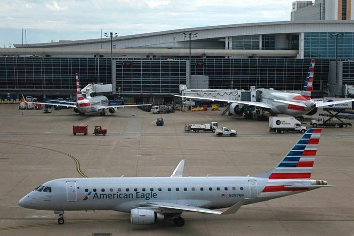 An airline worker died on Saturday after being "ingested" into the engine of American Airlines Embraer aircraft, like the kind pictured here at the Dallas/Fort Worth International airport in Dallas in June 2021.