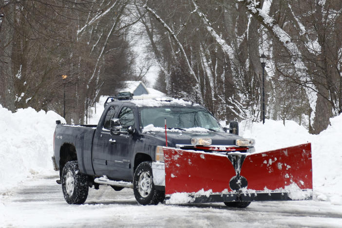 A plow clears snow after a winter storm rolled through Western New York Tuesday, Dec. 27, 2022, in Amherst, N.Y.