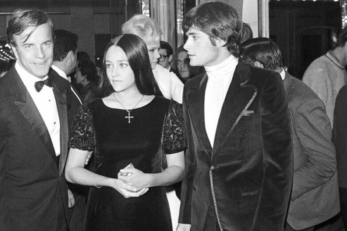 "Romeo & Juliet" actors Olivia Hussey, center, and Leonard Whiting, right, are seen in September 1968 with director Franco Zeffirelli after the Parisian premier of the film.