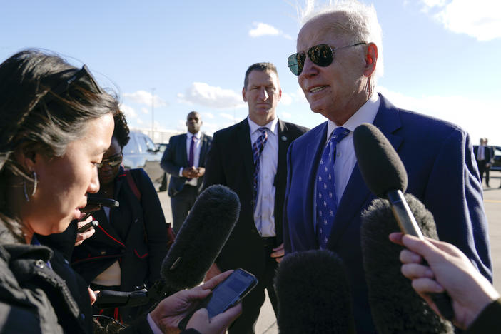 President Biden speaks to reporters before boarding Air Force One in Kentucky on Wednesday. Biden told reporters he plans to visit the southern U.S. border next week.