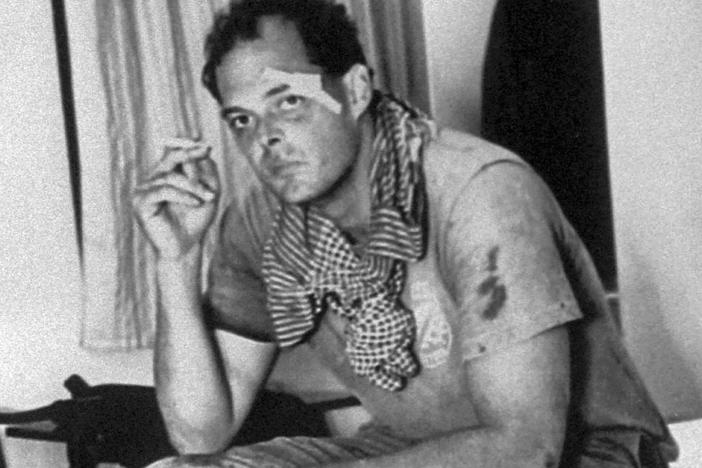 American journalist Nate Thayer sits bandaged in a hotel room on Oct. 15, 1989, in Aranyaprathet, Thailand, after he was injured in a land mine explosion. Thayer survived several brushes with death over decades covering conflict in Southeast Asia and was the last Western journalist to interview Pol Pot. He was found dead at his home in Falmouth, Mass., on Tuesday.