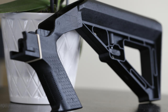 A bump stock is displayed on March 15, 2019, in Harrisonburg, Va. A Trump administration ban on bump stocks, devices that enable a shooter to rapidly fire multiple rounds from semi-automatic weapons after an initial trigger pull, was struck down Friday by a federal appeals court in New Orleans.