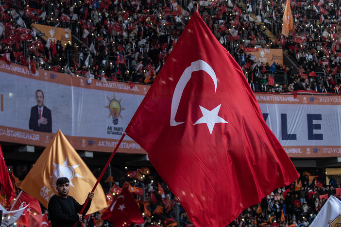 Supporters wave flags and cheer as they listen to Turkey's President Recep Tayyip Erdogan speak during the ruling AKP party's rally on Nov. 27, 2022 in Istanbul, Turkey.
