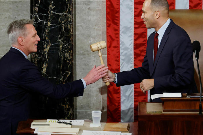 Speaker of the House Kevin McCarthy, R-Calif., receives the gavel from House Democratic leader Hakeem Jeffries, D-N.Y., after McCarthy was elected speaker in the House Chamber at the U.S. Capitol early Saturday morning.