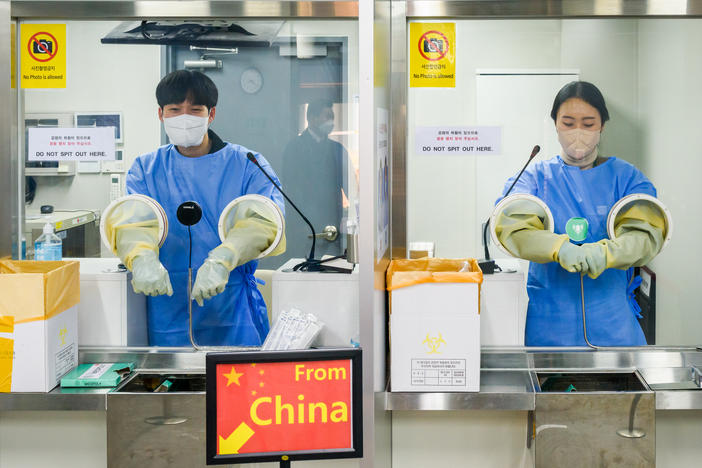 It's COVID testing time at Incheon International Airport, west of Seoul, South Korea. Arrivals from China must now submit to a PCR test.