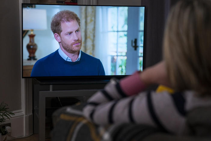 A person at home in Edinburgh, United Kingdom, watches Prince Harry, the Duke of Sussex, being interviewed by ITV's Tom Bradby during "Harry: The Interview," two days before his controversial autobiography "Spare" is published, Sunday, Jan. 8, 2023.
