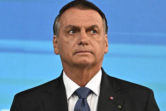 Former Brazilian President Jair Bolsonaro, pictured here at an election debate in October, left his country for Florida two days before his term ended.