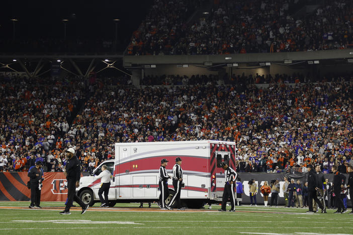 Fans look on as the ambulance leaves carrying Buffalo Bills player Damar Hamlin off the field on Jan. 2 after he collapsed after making a tackle against the Cincinnati Bengals.