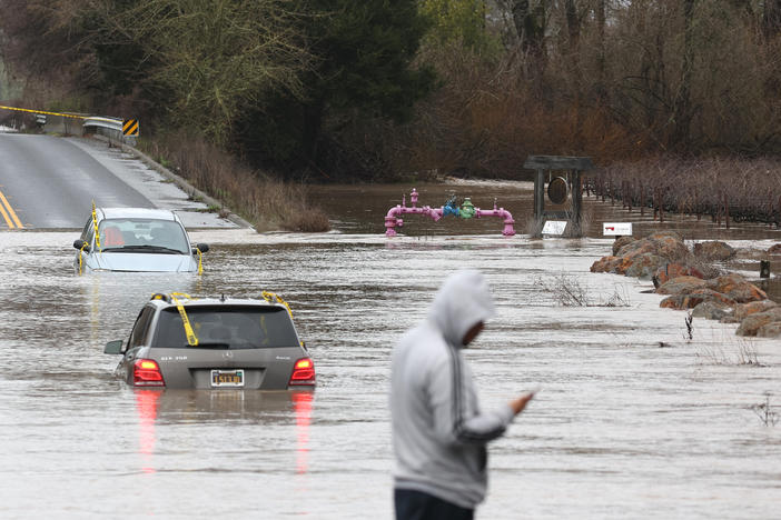 Cars are submerged in floodwater after heavy rain moved through the area on Monday in Windsor, California. The San Francisco Bay Area continues to get drenched by powerful atmospheric river events that have brought high winds and flooding rains.