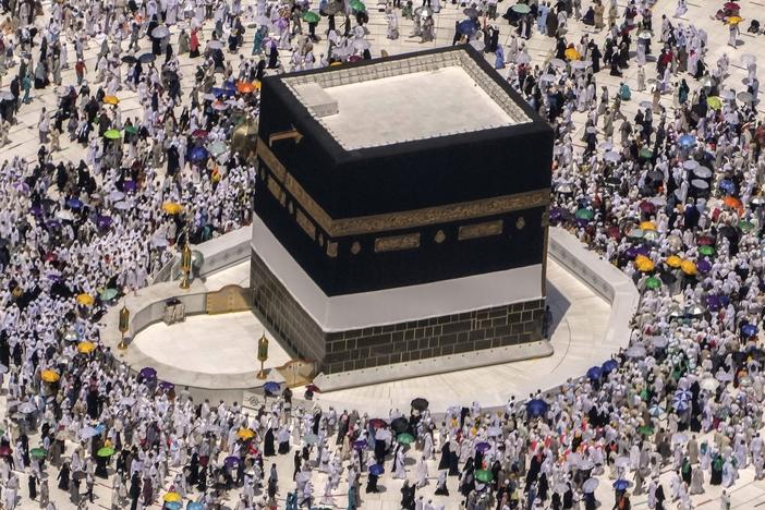 Muslim pilgrims walk around the Kaaba, the cubic building at the Grand Mosque, during the annual hajj pilgrimage, in Mecca, Saudi Arabia, on July 10, 2022.