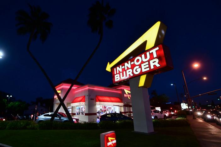 Drivers wait in the drive-thru line at an In-N-Out Burger restaurant in Alhambra, California, on August 30, 2018.