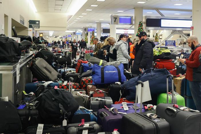 Stranded Southwest Airlines passengers look for their luggage in Chicago last month.