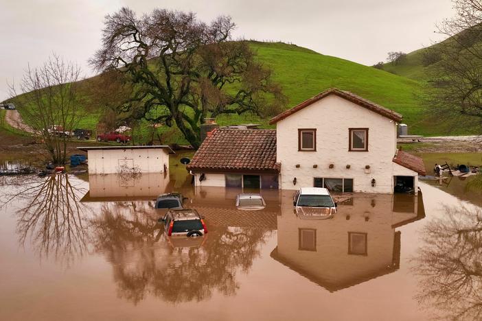 A house is partially underwater in Gilroy, Calif., on Monday.