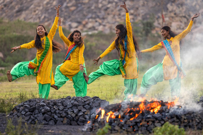 Radhika (15), Anjali (16), Suman (21), and Suhani (15) in July 2022 perform a dance routine near the village of Sahana Pahari, Jharia.