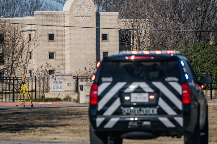 A police vehicle sits near the Congregation Beth Israel synagogue in Colleyville, Texas, on Jan. 16, 2022. Four people were held hostage at the synagogue for more than 10 hours by a gunman before being freed, one of a spate of antisemitic acts that took place last year.