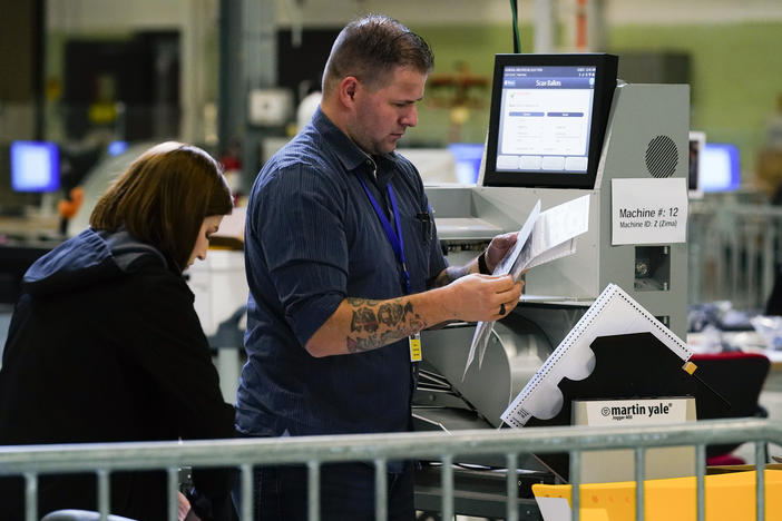 Election workers process mail ballots for the midterm elections in Philadelphia on Nov. 8, 2022.