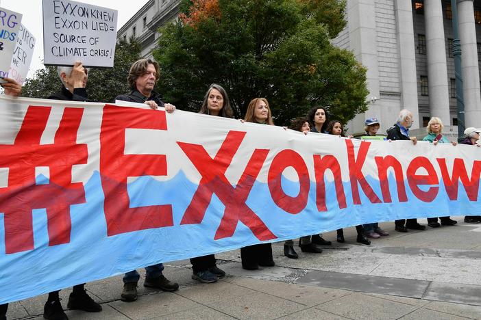 Climate activists protest on the first day of the ExxonMobil trial outside the New York State Supreme Court building on Oct. 22, 2019, in New York City. ExxonMobil was found not guilty of misleading investors about how climate change would affect its finances.