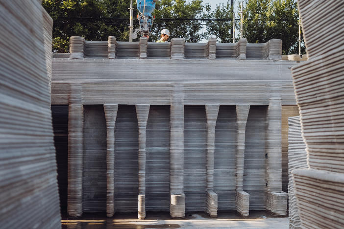 The project's design puts automated construction to the test with complicated features, like built-in shelving.