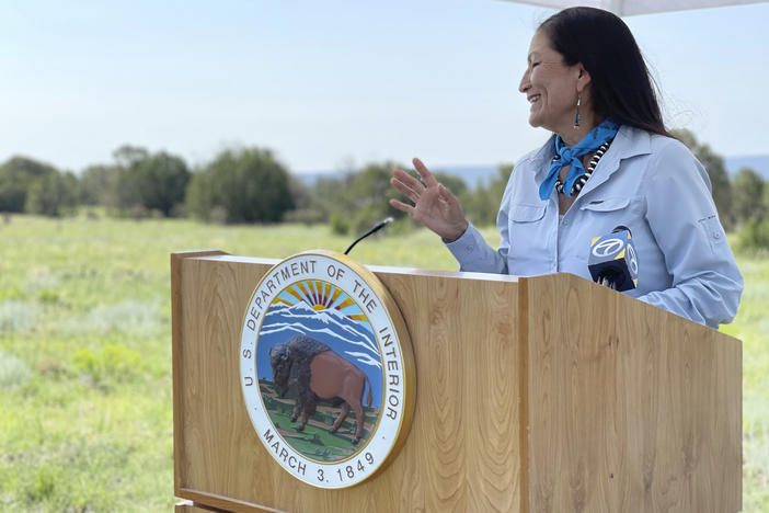 U.S. Interior Secretary Deb Haaland speaks at the Sabinoso Wilderness in Las Vegas, N.M., on July 17, 2021. The U.S. Department of the Interior has renamed five places in four states that had featured a racist term for a Native American woman.