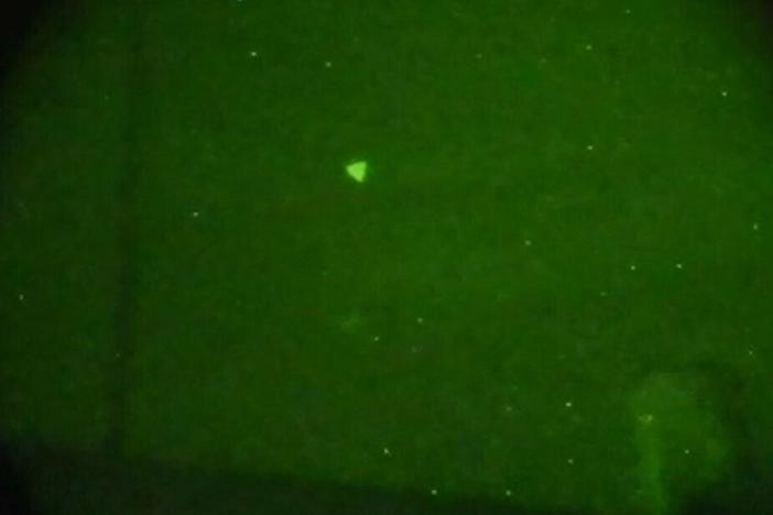 The Pentagon released this image of an Unidentified Aerial Phenomena (UAP) that was later determined to be a drone last year. The U.S. office that investigates UAP received hundreds of reports in 2022. This image was captured through night vision goggles during naval exercises off the U.S. East Coast in early 2022.