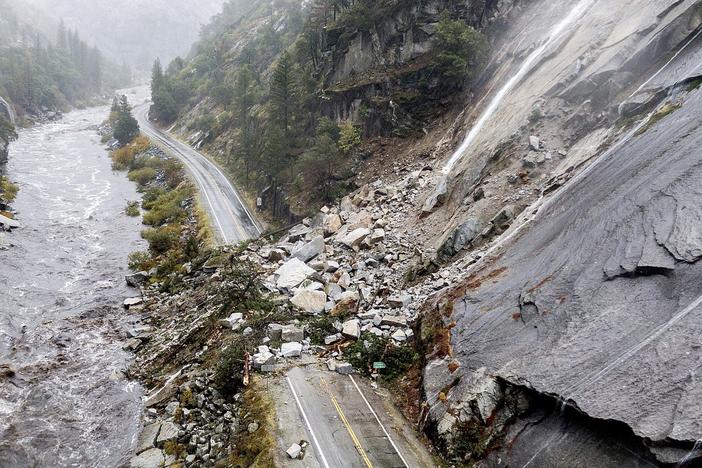 Rocks and vegetation cover Highway 70 following a landslide in the Dixie Fire zone on Oct. 24, 2021, in Plumas County, Calif.
