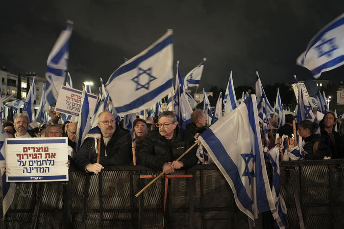 Israelis protest against the government's plans to overhaul the country's legal system, in Tel Aviv, Israel, Saturday, Jan. 14, 2023. The new government unveiled its plan this month proposing changes that critics say will weaken the country's judiciary and imperil its democratic system of checks and balances.