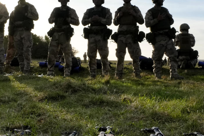 FILE - Weapons lie on the ground as Ukrainian personnel train at a base in Southern England. The U.S. military's new, expanded combat training of Ukrainian forces began in Germany on Sunday, Jan. 15th.