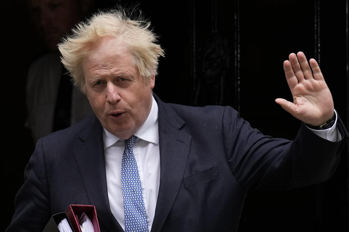 Then-British Prime Minister Boris Johnson leaves 10 Downing Street, in London, in May 2022. Johnson has signed a deal to write a memoir of his tumultuous time in office.