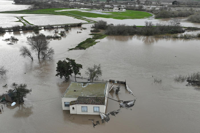 A home is submerged in floodwater, after the Salinas River overflowed its banks on Friday.