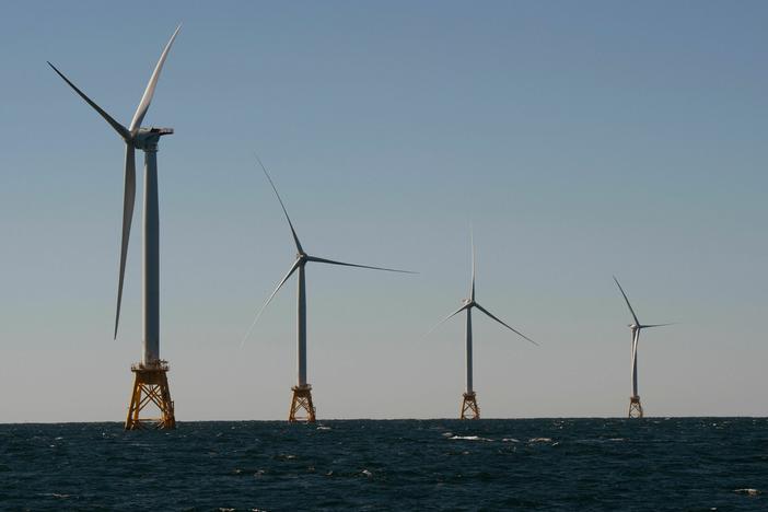 Wind turbines, of the Block Island Wind Farm, tower over the water on October 14, 2016 off the shores of Block Island, Rhode Island.