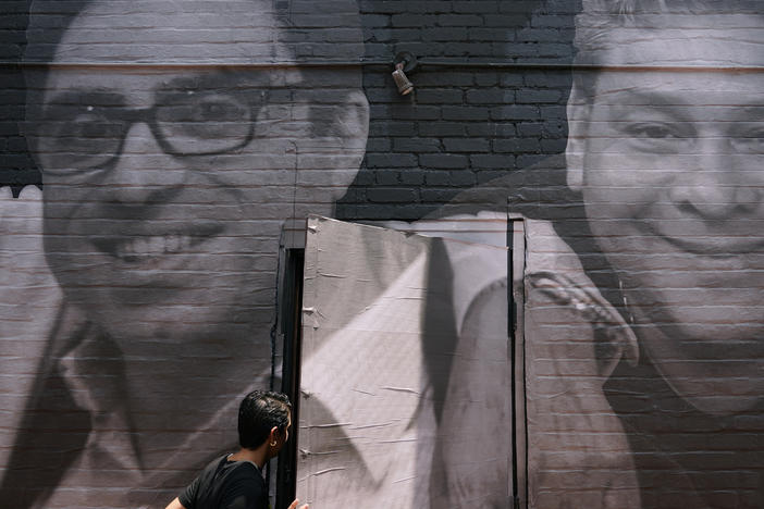 A mural in Washington, D.C. depicts Americans Siamak Namazi (left), who remains in Iran, and Jose Angel Pereira, who was released from Venezuela in October.