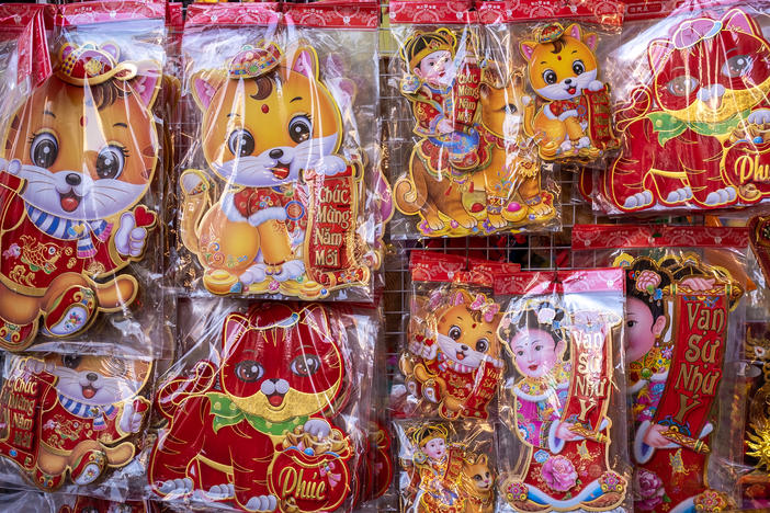 Cat stickers hang on display last week in Hanoi, Vietnam. The Lunar New Year begins on Sunday and marks the Year of the Cat in Vietnam and the Year of the Rabbit in China, South Korea and other East and Southeast Asian countries.