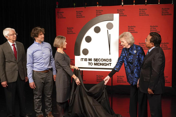 The Bulletin of the Atomic Scientists announced that it has moved the minute hand of the Doomsday Clock to 90 seconds to midnight. From left,, Siegfried Hecker, Daniel Holz, Sharon Squassoni, Mary Robinson and Elbegdorj Tsakhia with the Bulletin of the Atomic Scientists remove a cloth covering the Doomsday Clock at a news conference at the National Press Club in Washington on Tuesday.