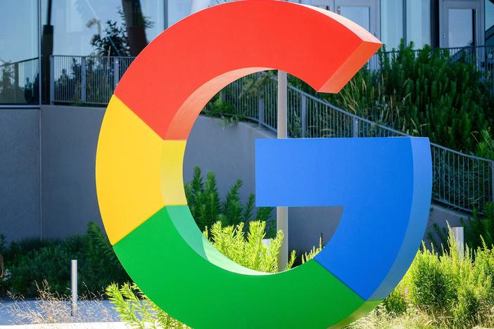 A worker walks along a path at Googles Bay View campus in Mountain View, Calif., on June 27, 2022.