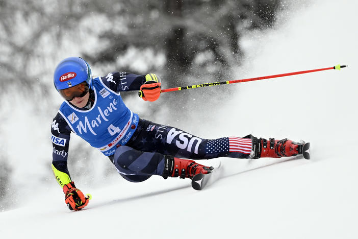 Mikaela Shiffrin seized first place in her first run in the giant slalom in Kronplatz, Italy, bidding to make history in the World Cup.