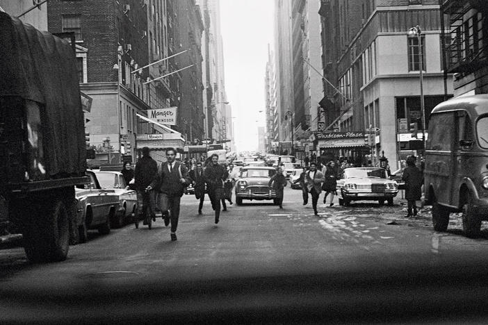 "The crowds chasing us in <em>A Hard Day's Night </em>were based on moments like this," McCartney writes. "Taken out of the back of our car on West Fifty-Eighth, crossing the Avenue of the Americas."