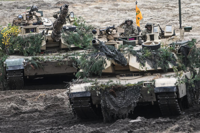 U.S. Abrams tanks participate in a live fire demonstration during training exercises in Poland in September 2022. President Biden announced Wednesday that the U.S. will be sending 31 Abrams tanks to Ukraine. Germany also said it will be sending tanks.