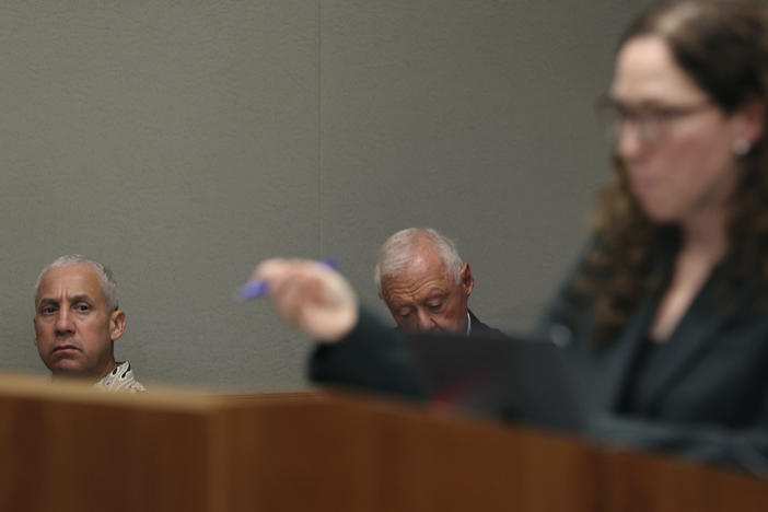 Albert "Ian" Schweitzer, left, looks on as Innocence Project attorney Susan Freidman speaks during Schweitzer's court case Tuesday, Jan. 24, 2023, in Hilo, Hawaii.