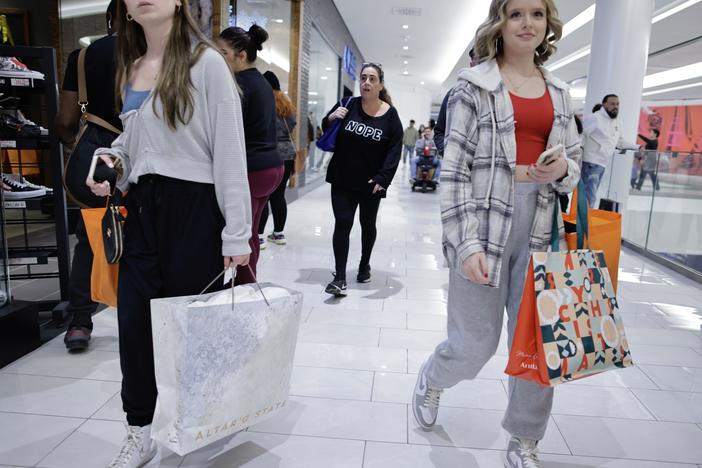Women carry shopping bags as customers visit the American Mall dream mall during Black Friday on Nov. 25, 2022 in East Rutherford, N.J. The U.S. economy ended 2022 on a strong note, but fears of a recession are growing.