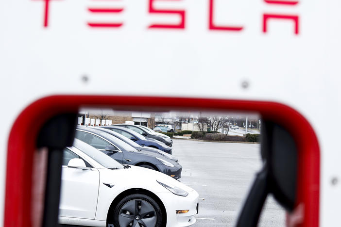 A Tesla charging station stands in a parking lot in Springfield, Va., on Jan. 17. The automaker decreased the prices of Teslas by up to 20%, a move seen as a reaction to competition in the global market for electric vehicles and rising inflation rates.